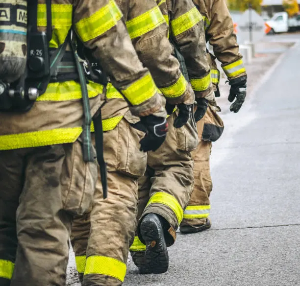 Firefighter in action gear responding to an emergency